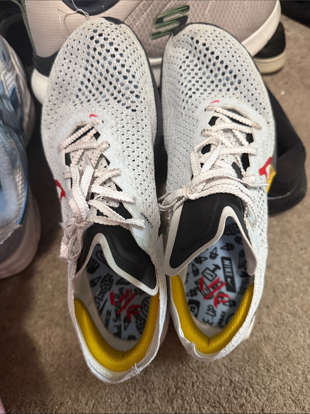 Nike Grey Knit Running Shoes with Red Swoosh and Yellow Accent